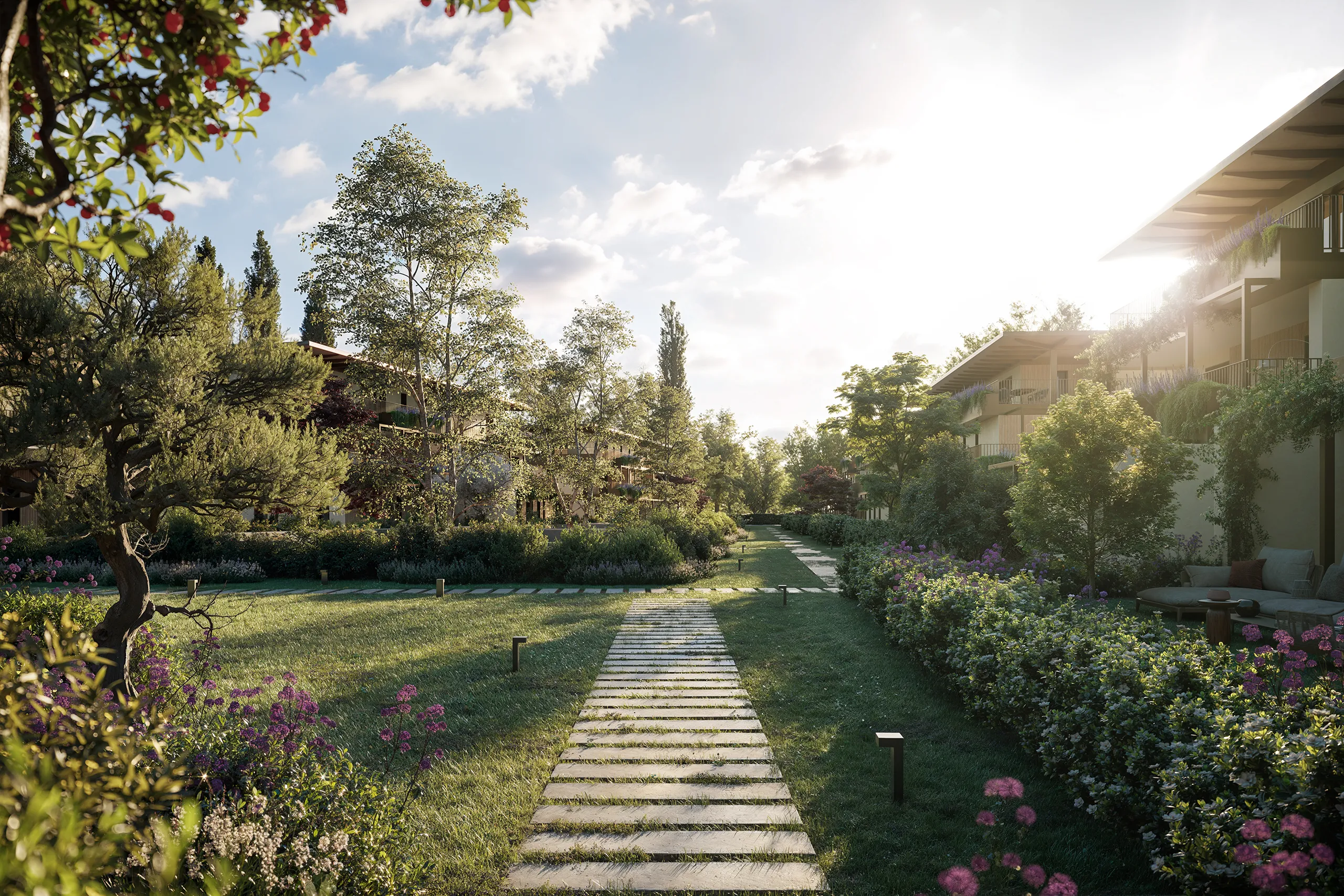 Spazi comuni delle Case nel Parco di Mulini Mandelli, tra percorsi verdi, aree di relazione e nuove residenze contemporanee.